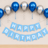 Blue and silver metallic birthday decoration with balloons, ribbon curls and happy birthday banner for party setup.