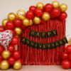Red and gold Happy Anniversary balloon decoration with black gold banner, love you foil balloons and golden confetti balloons for anniversary party setup.