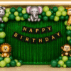 Safari theme birthday decoration with green balloon arch, animal foil balloons, green fringe curtain and happy birthday banner.