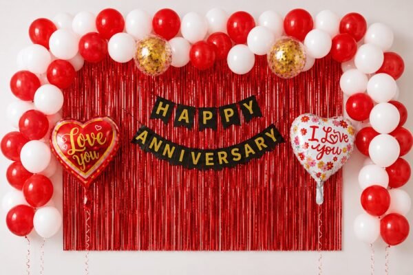 anniversary-red-white-optimized Red white anniversary decoration with foil curtain, black gold banner and Love You heart foils