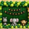jungle-safari-optimized Jungle theme birthday decoration with green balloon arch, animal foil balloons, green foil curtain and happy birthday banner.