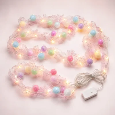 Pastel pom pom LED string light with pink glitter mesh and warm white lights